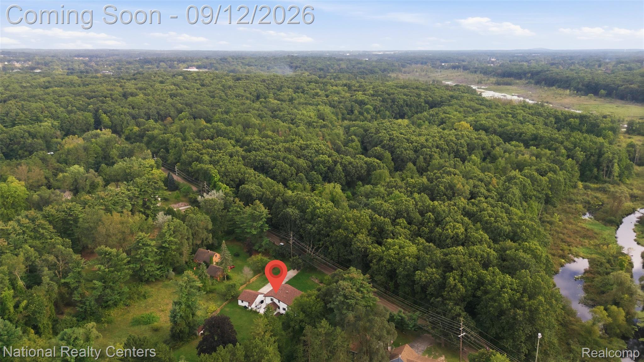 2631 Garden Road Milford, MI 48381 - Photo 35 of 40 Expansive property surrounded by mature trees, featuring a visible winding river