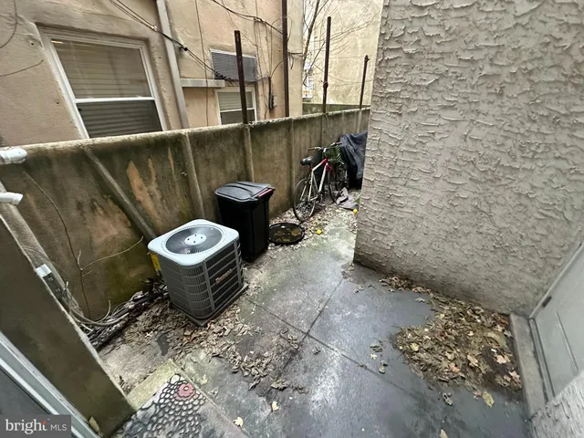 a view of a patio of back yard of the house