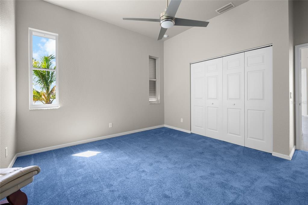 1950 Arkansas Avenue Englewood, FL 34224 - Photo 11 of 52 an empty room with windows and closet