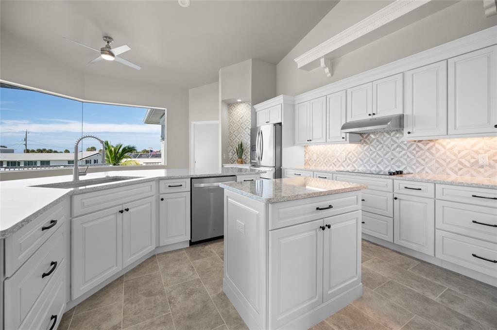 1950 Arkansas Avenue Englewood, FL 34224 - Photo 15 of 52 a kitchen with cabinets appliances and a sink