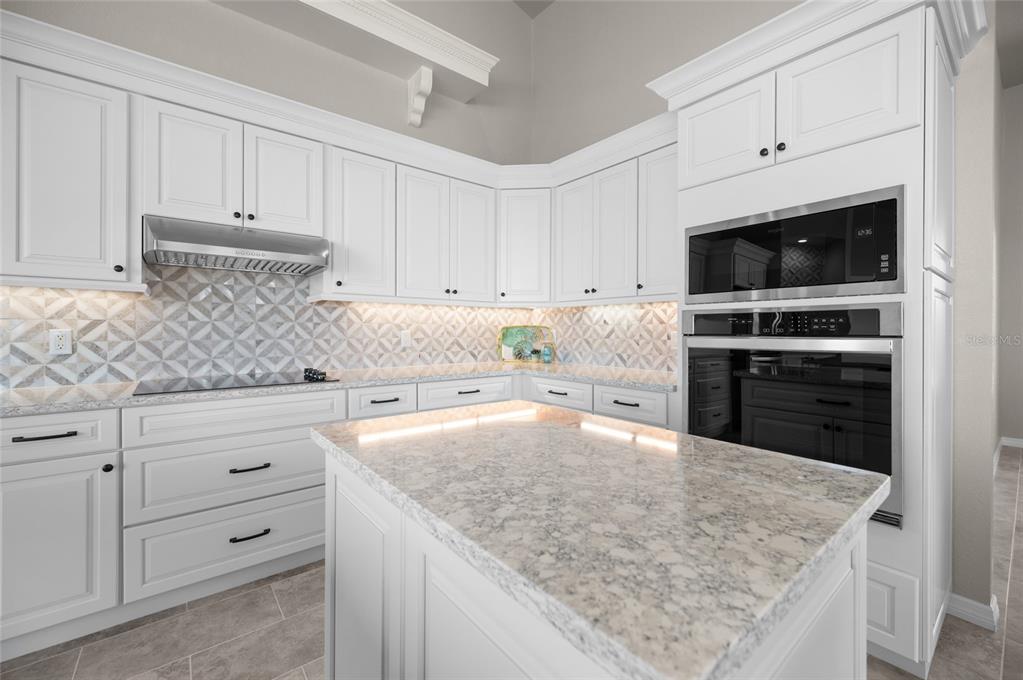 1950 Arkansas Avenue Englewood, FL 34224 - Photo 16 of 52 a kitchen with cabinets appliances and a counter space