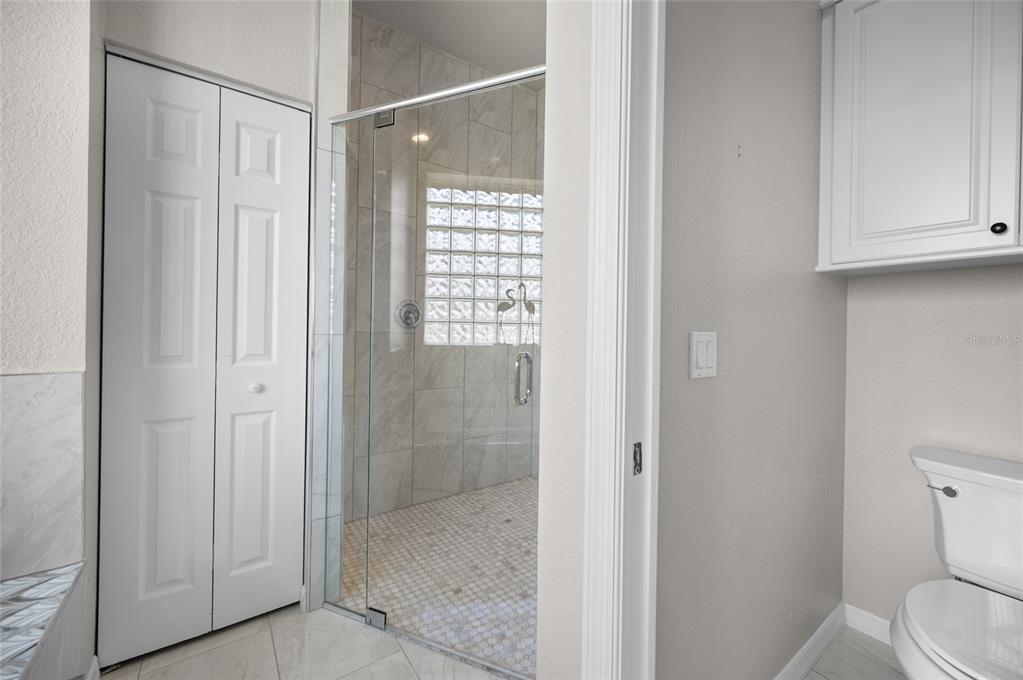 1950 Arkansas Avenue Englewood, FL 34224 - Photo 24 of 52 a bathroom with a shower and a toilet