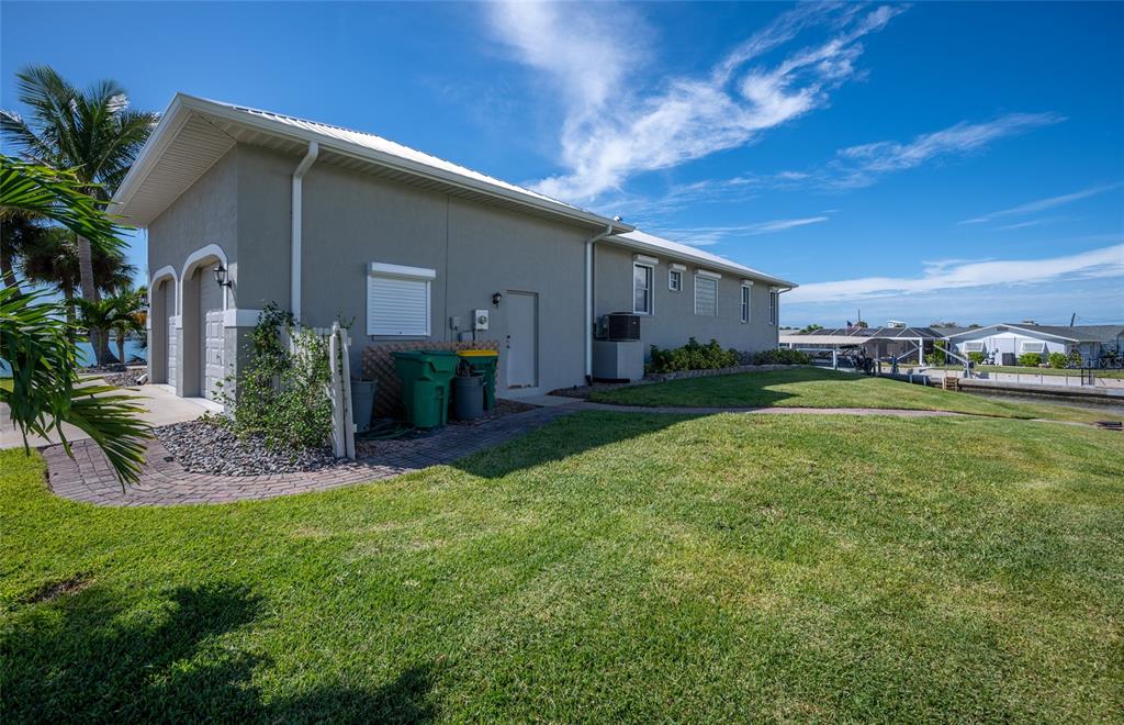 1950 Arkansas Avenue Englewood, FL 34224 - Photo 41 of 52 a view of a house with a yard