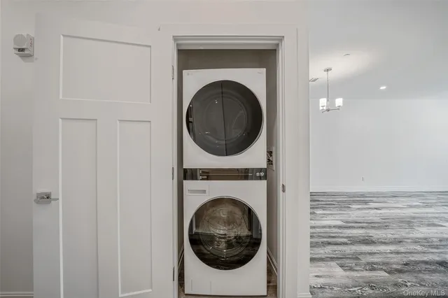 a kitchen with a sink cabinets and wooden floor