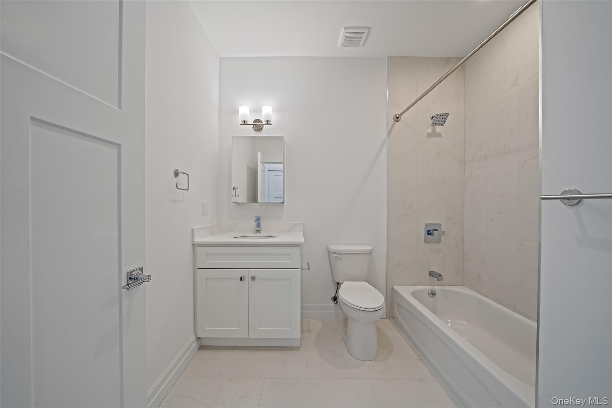 103 Dover Street Central Islip, NY 11722 - Photo 22 of 45 Full bathroom with shower / tub combination and vanity