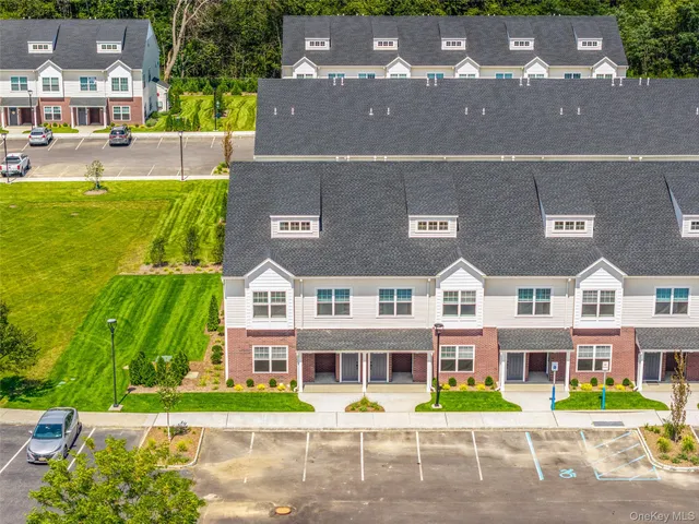 an aerial view of a building with swimming pool