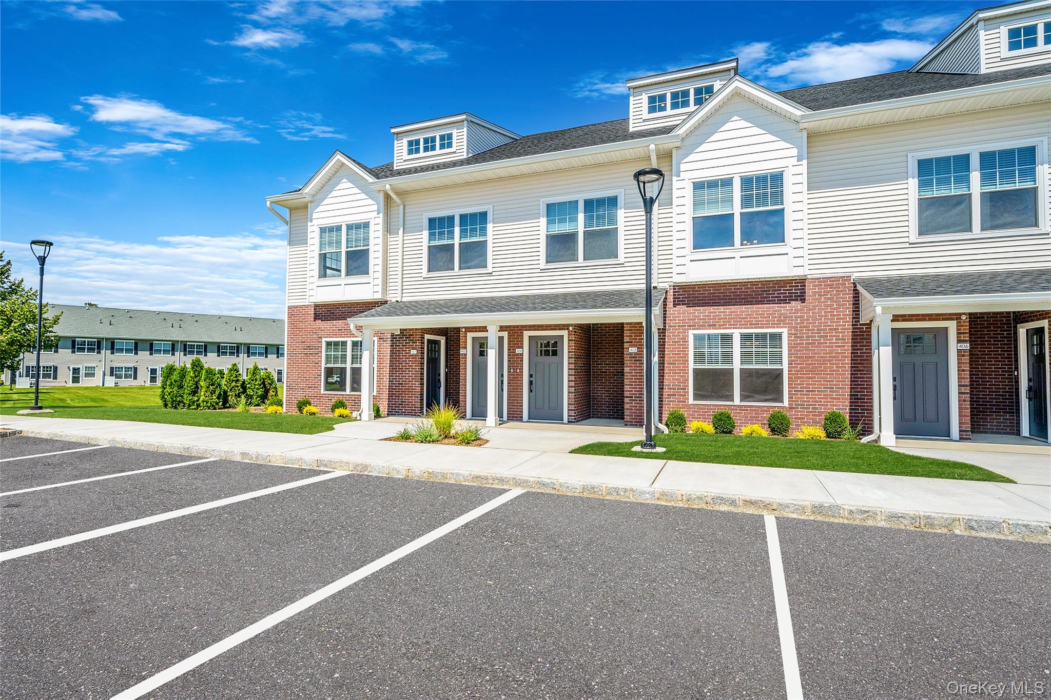 103 Dover Street Central Islip, NY 11722 - Photo 4 of 45 View of front of house featuring uncovered parking and brick siding