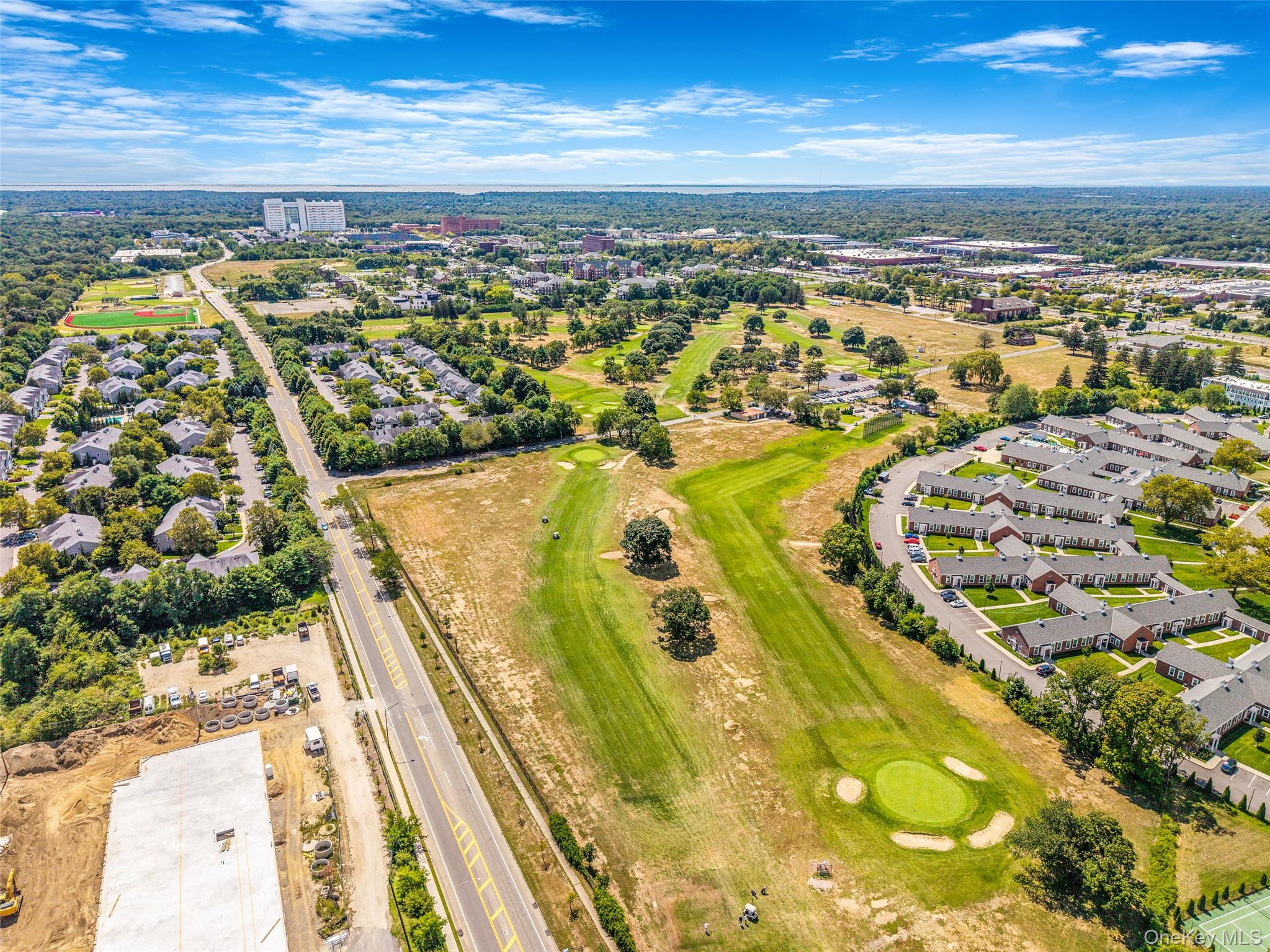 103 Dover Street Central Islip, NY 11722 - Photo 41 of 45 Aerial perspective of suburban area featuring a local golf course