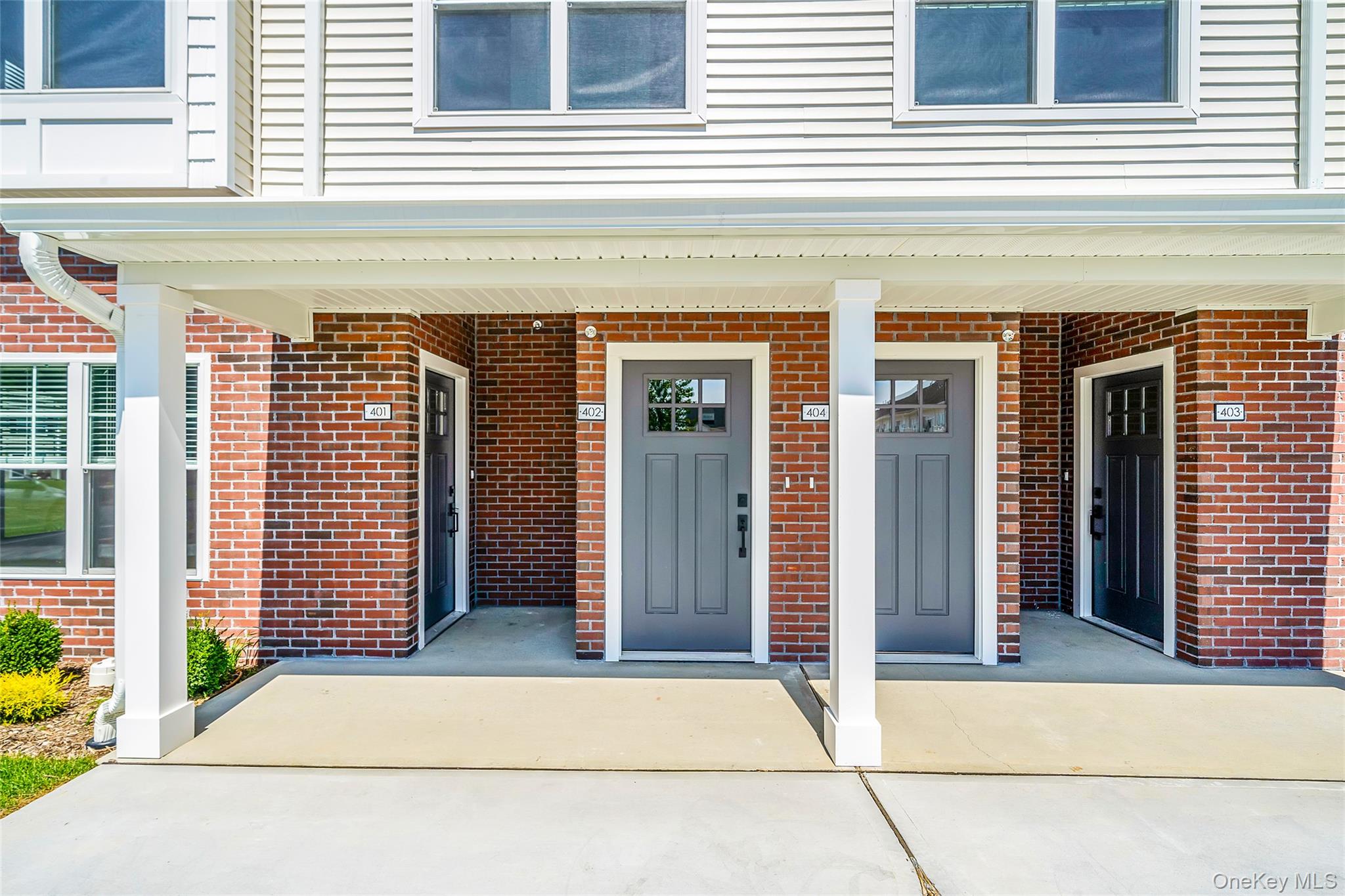 103 Dover Street Central Islip, NY 11722 - Photo 5 of 45 Doorway to property with brick siding and covered porch