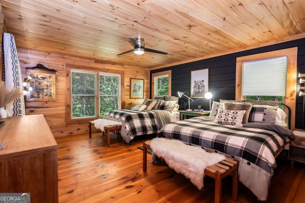 16 Toccoa Ridge Road, Unit 8 Mineral Bluff, GA 30559 - Photo 17 of 35 a bedroom with furniture and wooden floor