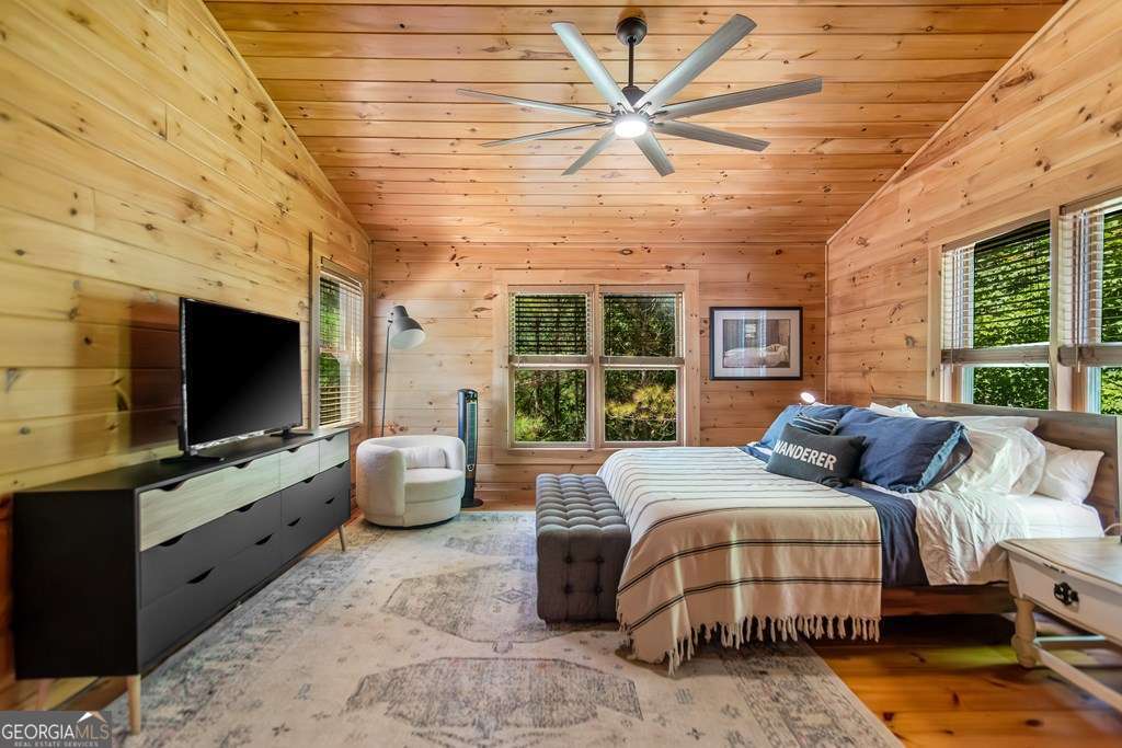 16 Toccoa Ridge Road, Unit 8 Mineral Bluff, GA 30559 - Photo 22 of 35 a bedroom with furniture and a flat screen tv