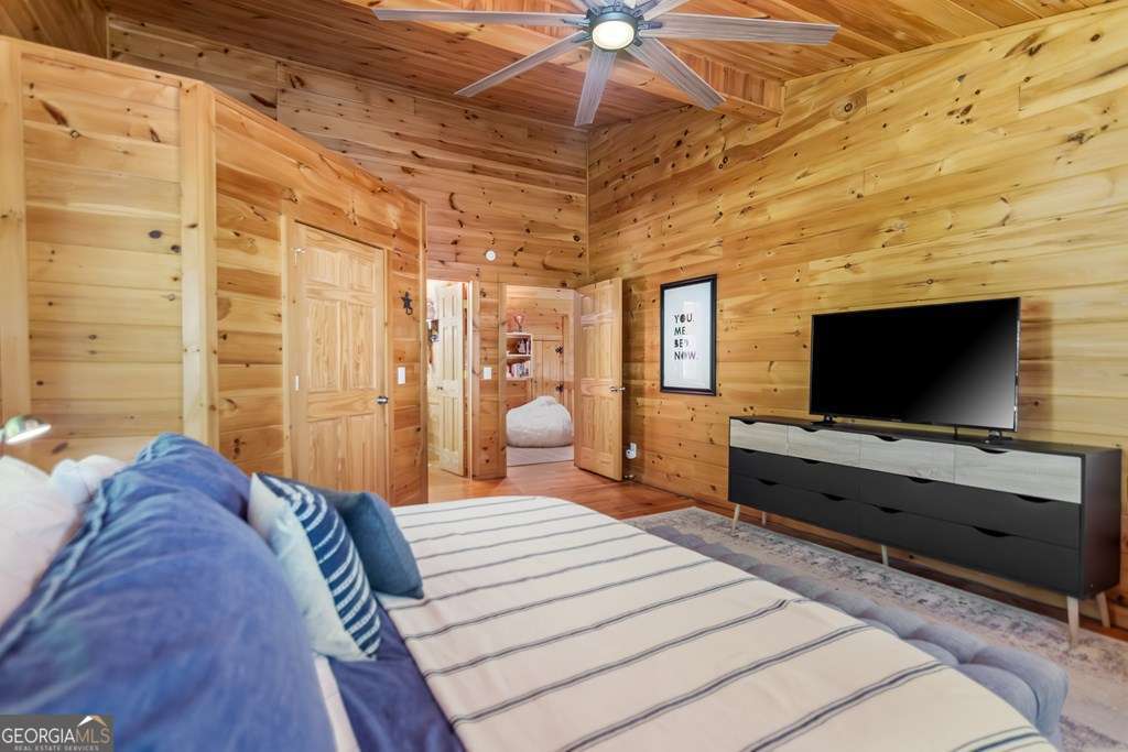 16 Toccoa Ridge Road, Unit 8 Mineral Bluff, GA 30559 - Photo 23 of 35 a bedroom with a bed and a flat screen tv
