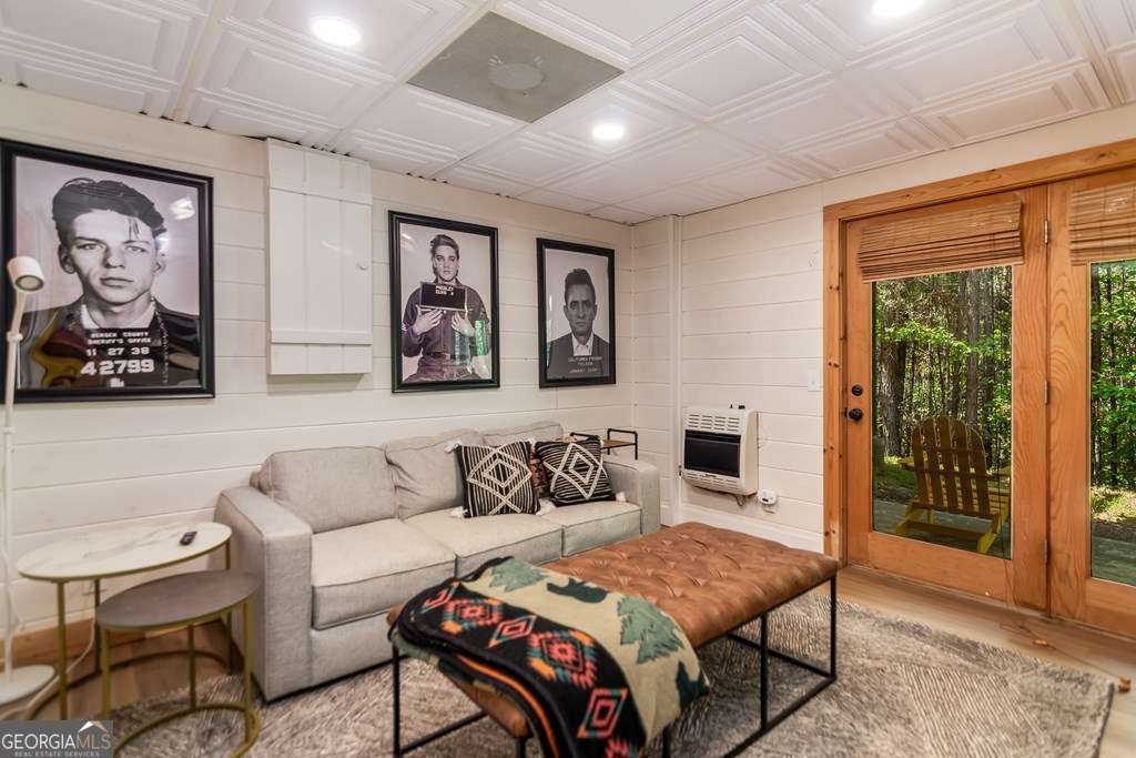 16 Toccoa Ridge Road, Unit 8 Mineral Bluff, GA 30559 - Photo 27 of 35 a bedroom with furniture and a fireplace