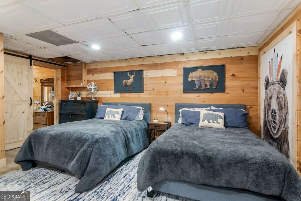 16 Toccoa Ridge Road, Unit 8 Mineral Bluff, GA 30559 - Photo 30 of 35 a spacious bedroom with two beds and a walk in closet