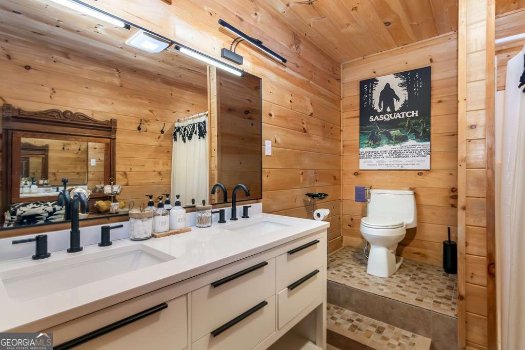 16 Toccoa Ridge Road, Unit 8 Mineral Bluff, GA 30559 - Photo 32 of 35 a bathroom with a double vanity sink toilet and a mirror