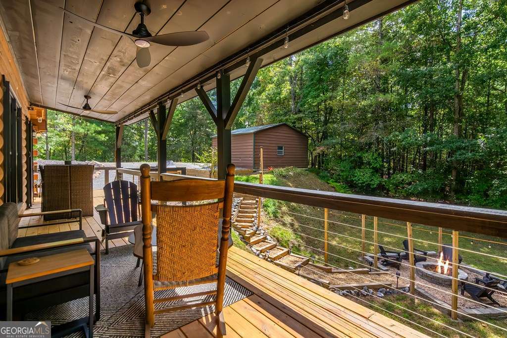 16 Toccoa Ridge Road, Unit 8 Mineral Bluff, GA 30559 - Photo 34 of 35 a view of a balcony with chairs