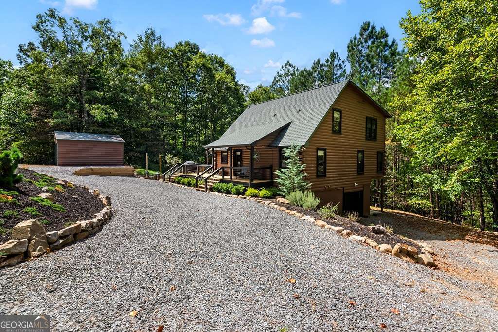 16 Toccoa Ridge Road, Unit 8 Mineral Bluff, GA 30559 - Photo 4 of 35 a front view of a house with a garden