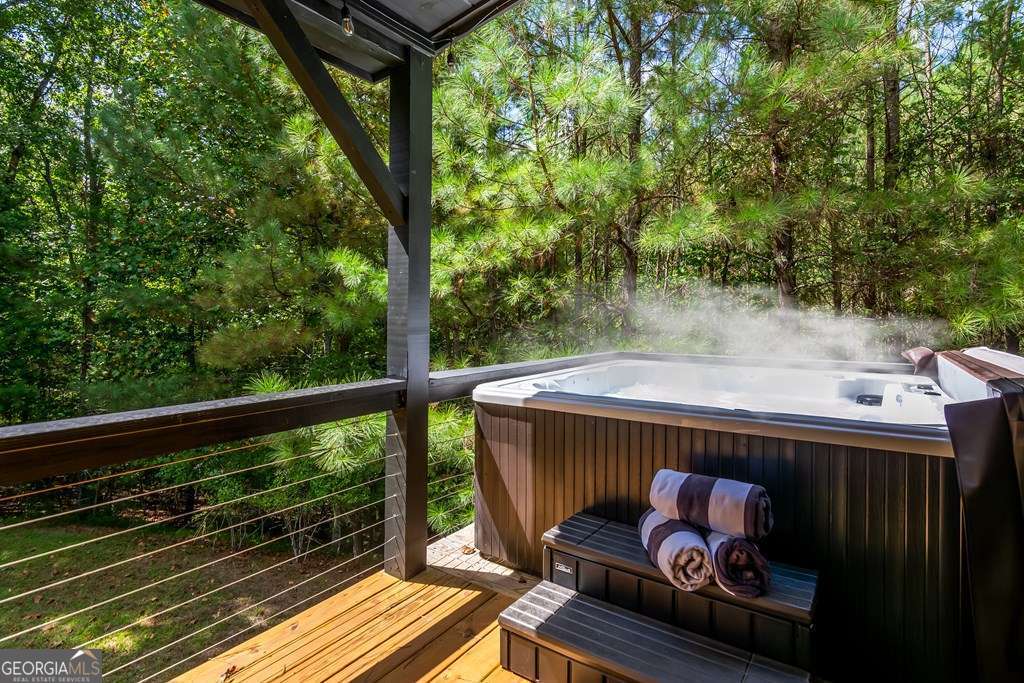 16 Toccoa Ridge Road, Unit 8 Mineral Bluff, GA 30559 - Photo 5 of 35 a backyard of a house with wooden floor barbeque oven and outdoor seating