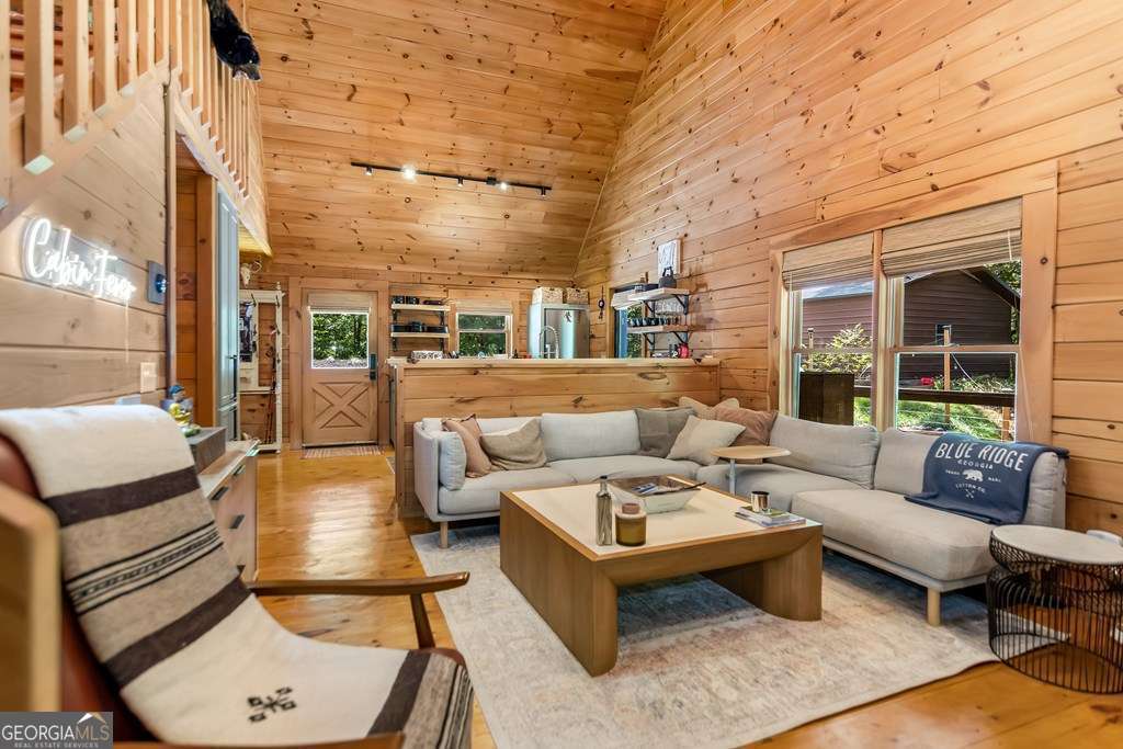 16 Toccoa Ridge Road, Unit 8 Mineral Bluff, GA 30559 - Photo 8 of 35 a patio with patio couch and dining table