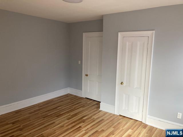 129 Union Street Hackensack, NJ 07601 - Photo 10 of 10 a view of a room with wooden floor and closet