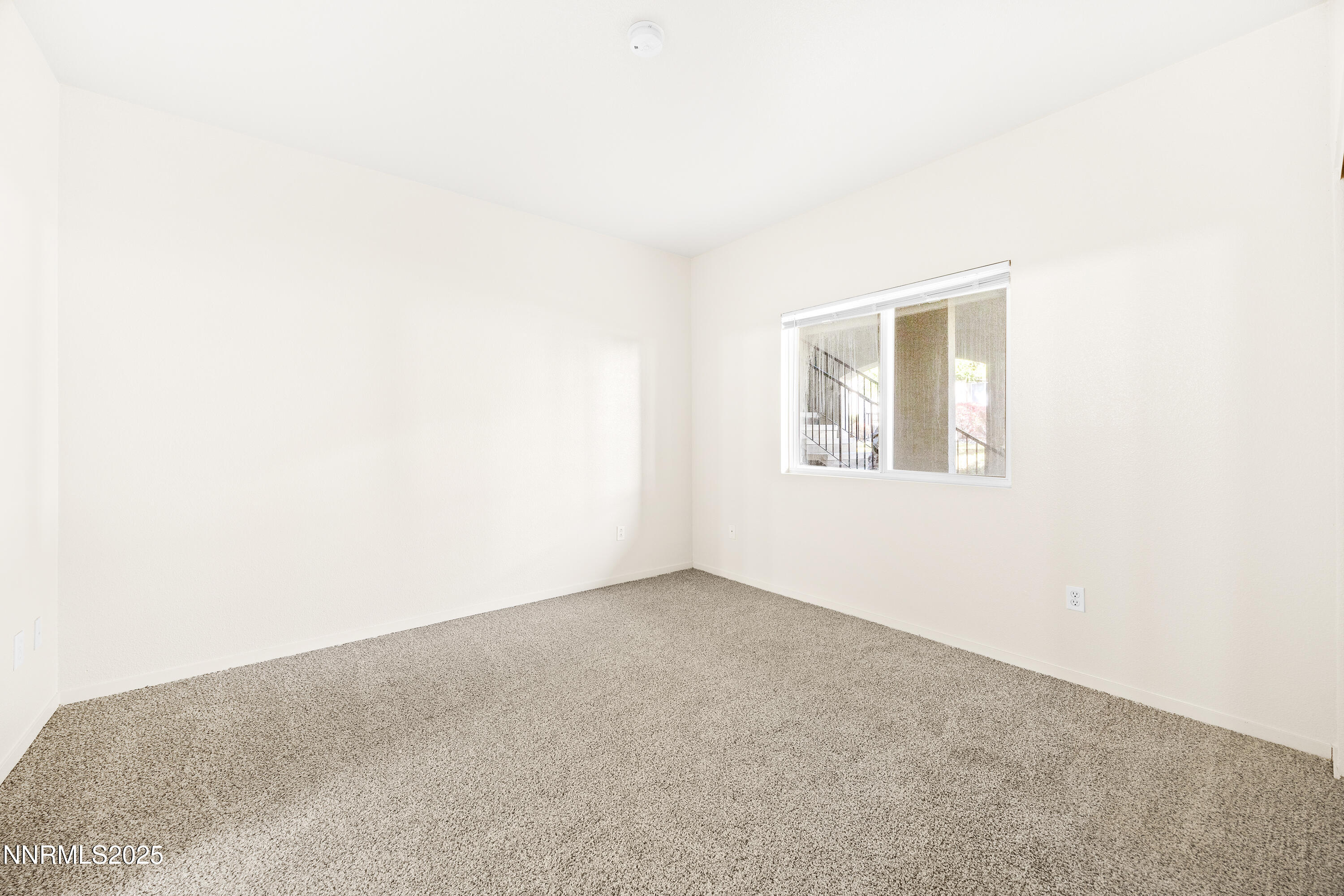6850 Sharlands Avenue, Unit T1116 Reno, NV 89523 - Photo 12 of 26 an empty room with a window