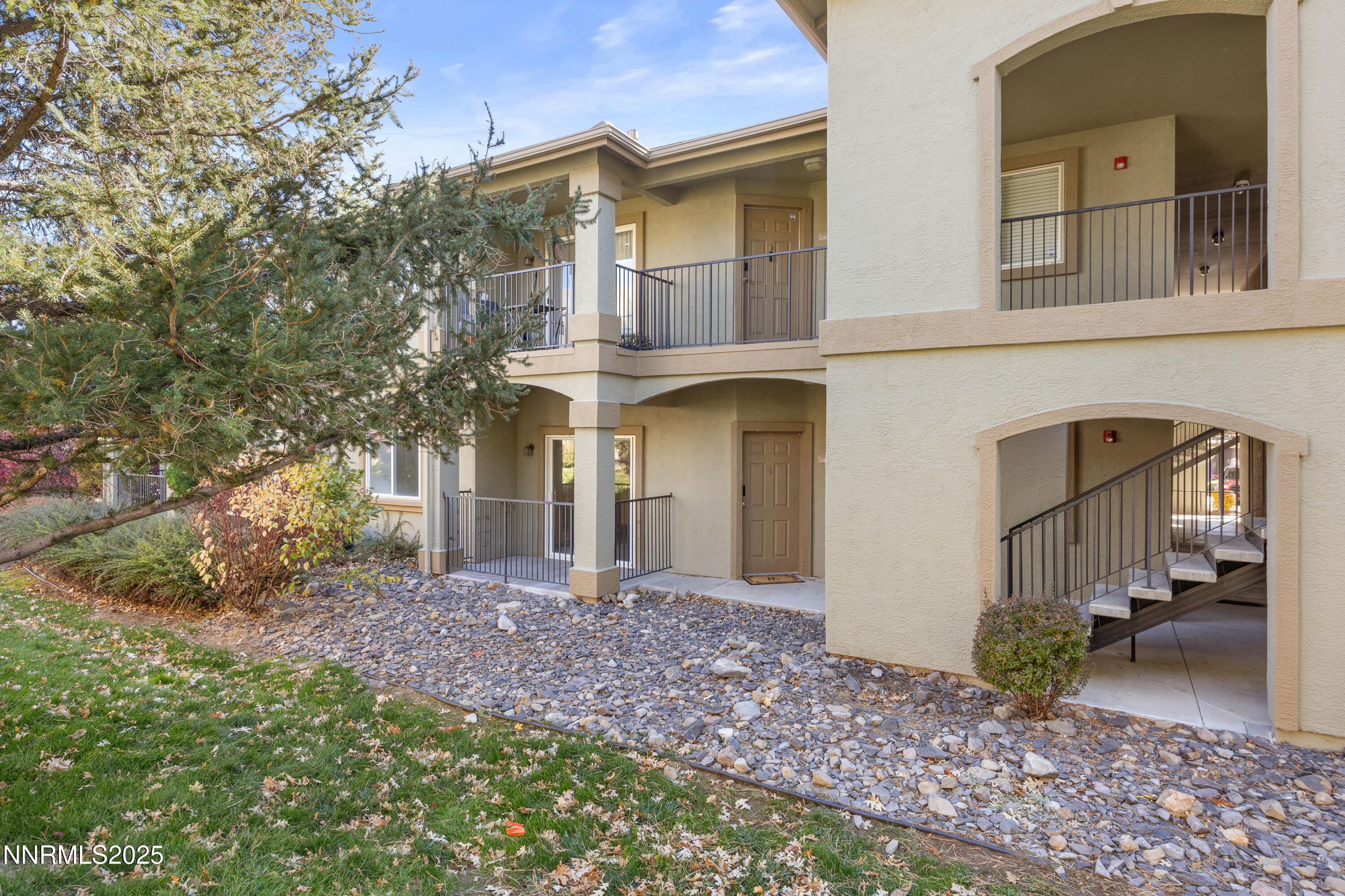 6850 Sharlands Avenue, Unit T1116 Reno, NV 89523 - Photo 4 of 26 a front view of a house with a yard