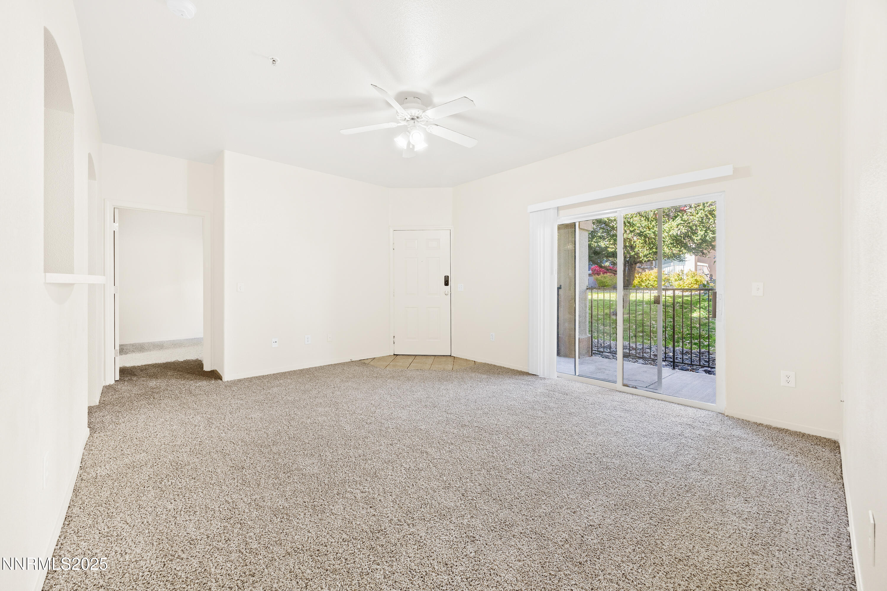 6850 Sharlands Avenue, Unit T1116 Reno, NV 89523 - Photo 7 of 26 an empty room with windows and fan