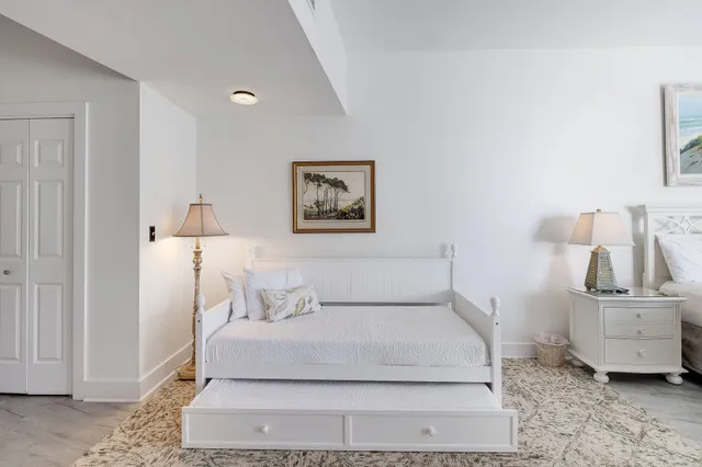 a bedroom with a bed and a couch