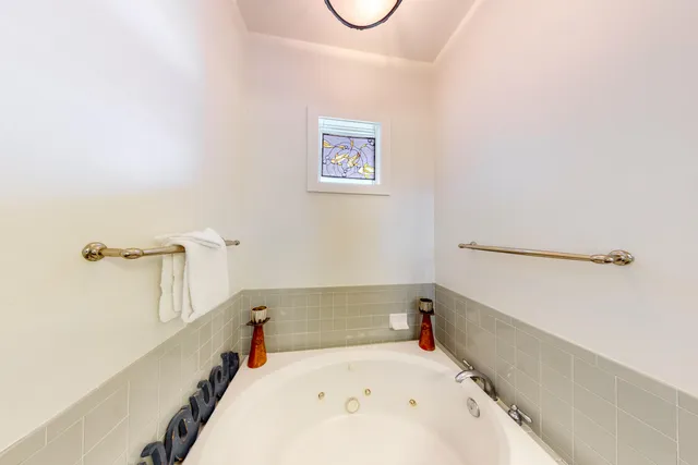 a bathroom with a tub and a shower