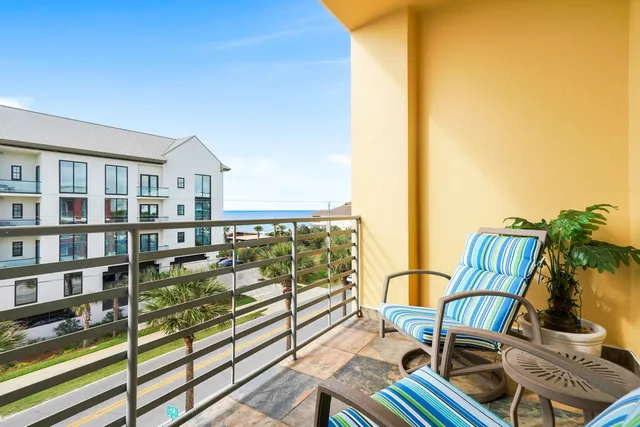 a view of a balcony with chairs