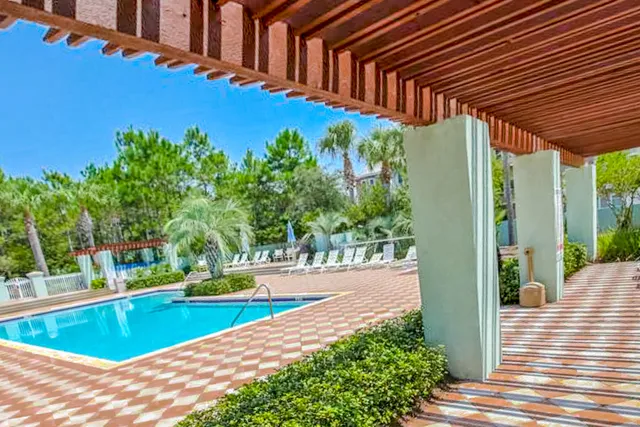 front view of a building with a garden