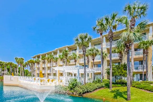 a street sign on a road next to a building