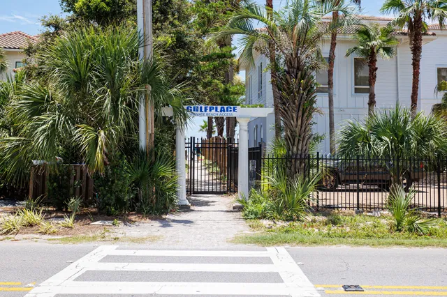 a view of a swimming pool with an outdoor seating