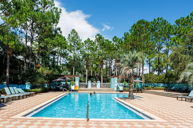 a view of a swimming pool with a sitting area