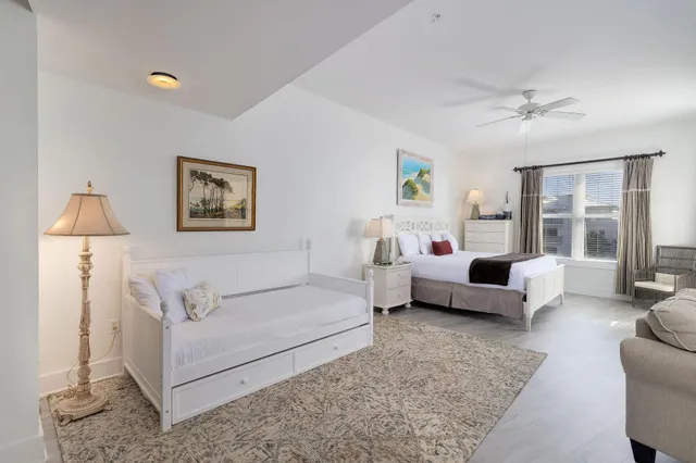 a living room with furniture and a lamp