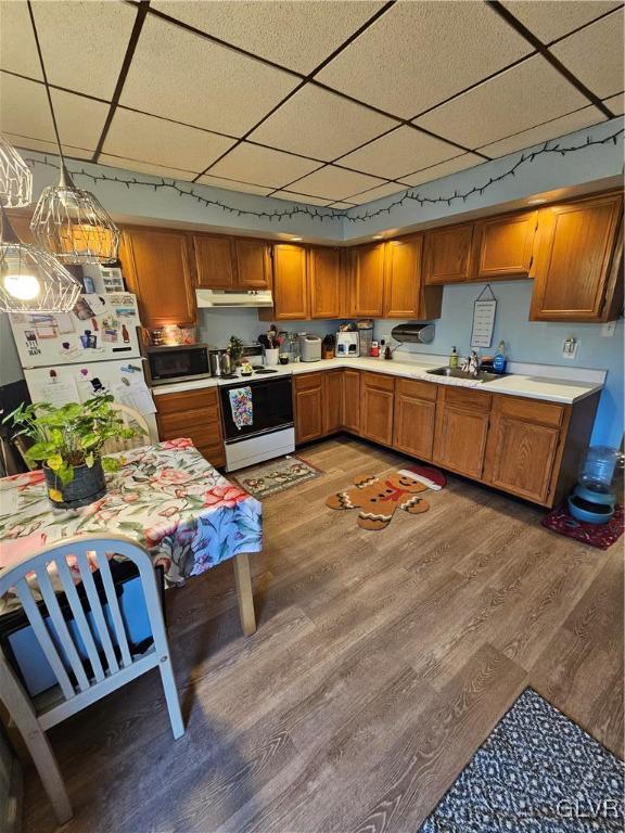 26 East Ridge Street Coaldale, PA 18218 - Photo 3 of 17 a kitchen with stainless steel appliances granite countertop a sink and wooden floors
