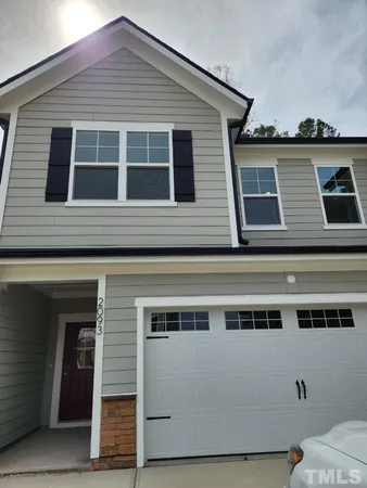 a view of a house with a garage