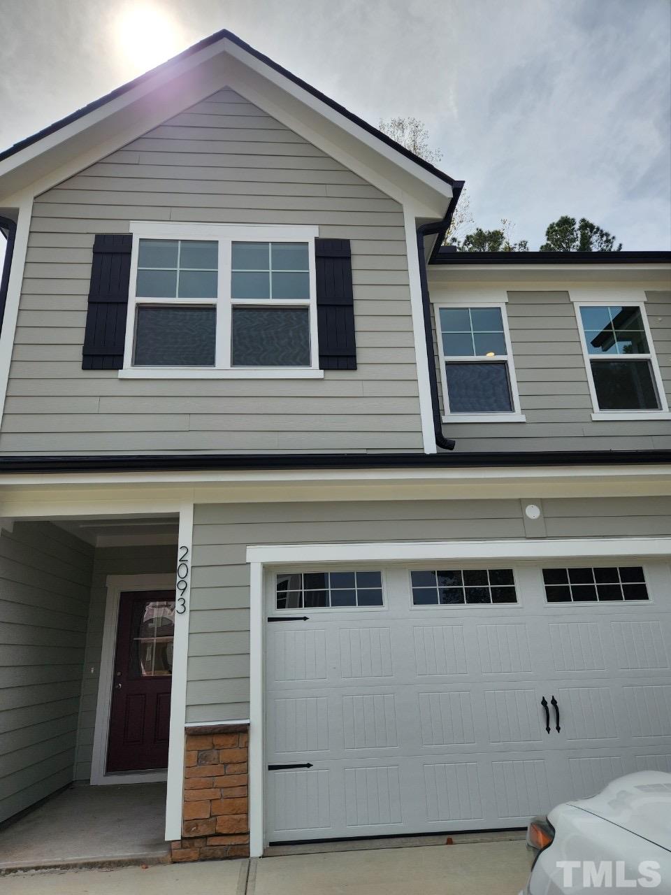 2093 Shaded Knoll Road Cary, NC 27519 - Photo 1 of 9 a view of a house with a garage