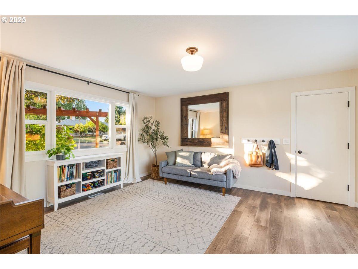 1200 Elm Lane Newberg, OR 97132 - Photo 14 of 32 a living room with furniture and a flat screen tv