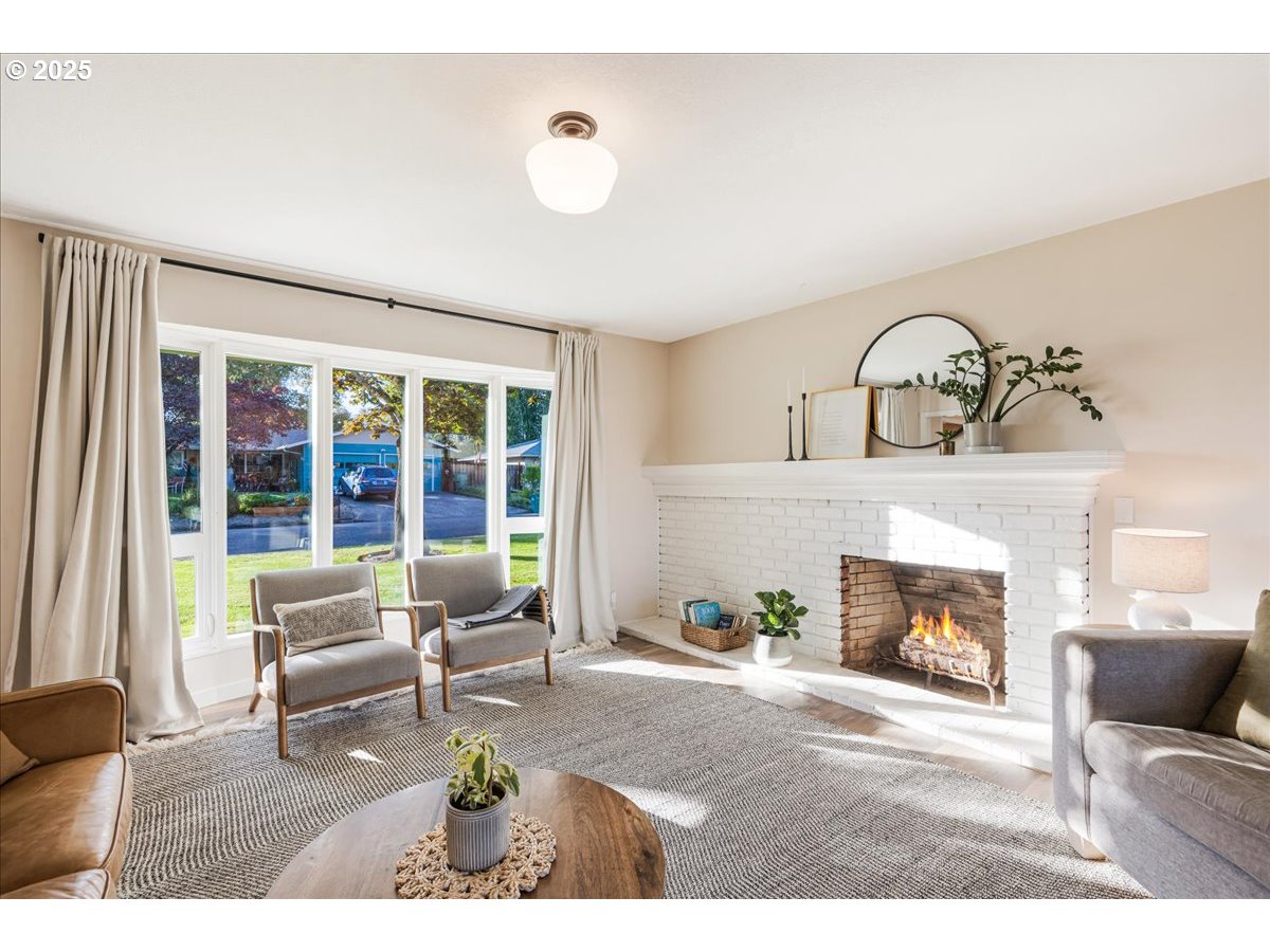 1200 Elm Lane Newberg, OR 97132 - Photo 5 of 32 a living room with furniture and a fireplace