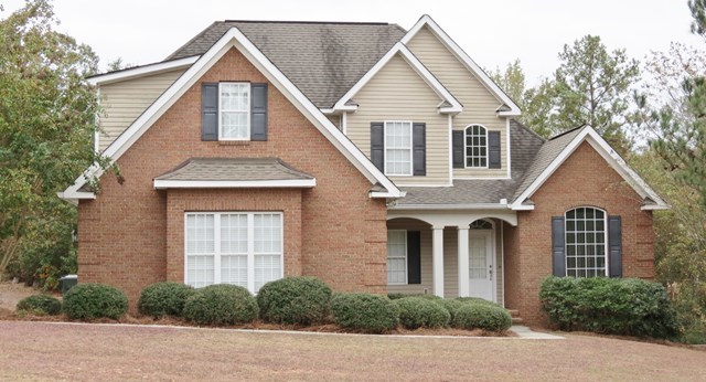 321 Eagle Ridge Road Macon, GA 31216 - Photo 1 of 23 a view of a white house next to a yard