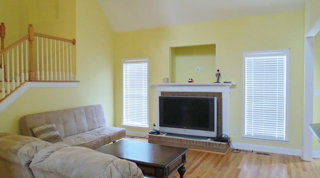 321 Eagle Ridge Road Macon, GA 31216 - Photo 3 of 23 a living room with furniture and a fireplace