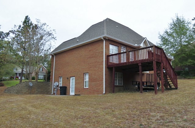 321 Eagle Ridge Road Macon, GA 31216 - Photo 21 of 23 a view of a house with a yard and roof