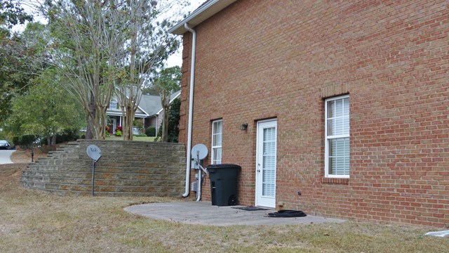 321 Eagle Ridge Road Macon, GA 31216 - Photo 22 of 23 a view of a brick house with many windows
