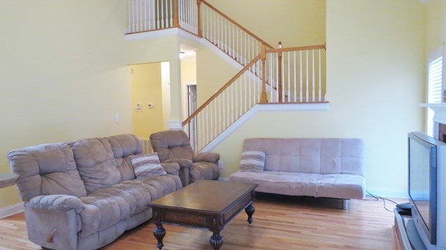 321 Eagle Ridge Road Macon, GA 31216 - Photo 4 of 23 a living room with furniture and a wooden floor