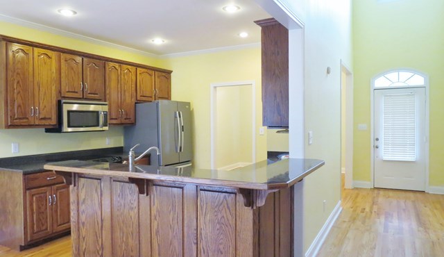 321 Eagle Ridge Road Macon, GA 31216 - Photo 6 of 23 a kitchen with stainless steel appliances a refrigerator and a stove top oven