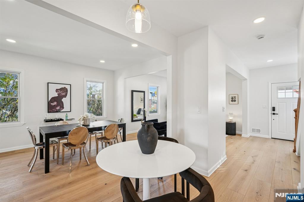 51 Highland Place Ridgefield Park, NJ 07660 - Photo 13 of 35 a view of a dining room with furniture and wooden floor