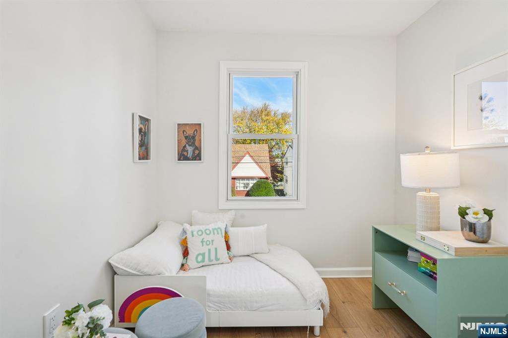 51 Highland Place Ridgefield Park, NJ 07660 - Photo 27 of 35 a bedroom with a bed and window