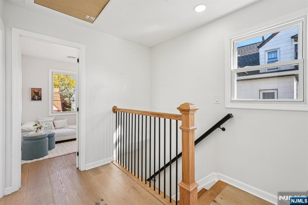 51 Highland Place Ridgefield Park, NJ 07660 - Photo 30 of 35 a view of a hallway with bedroom and wooden floor