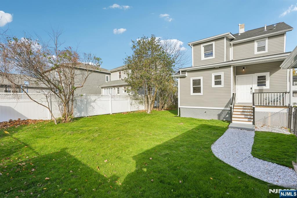 51 Highland Place Ridgefield Park, NJ 07660 - Photo 35 of 35 a front view of a house with a yard